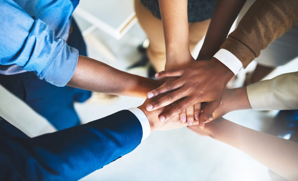 diverse hands in a circle